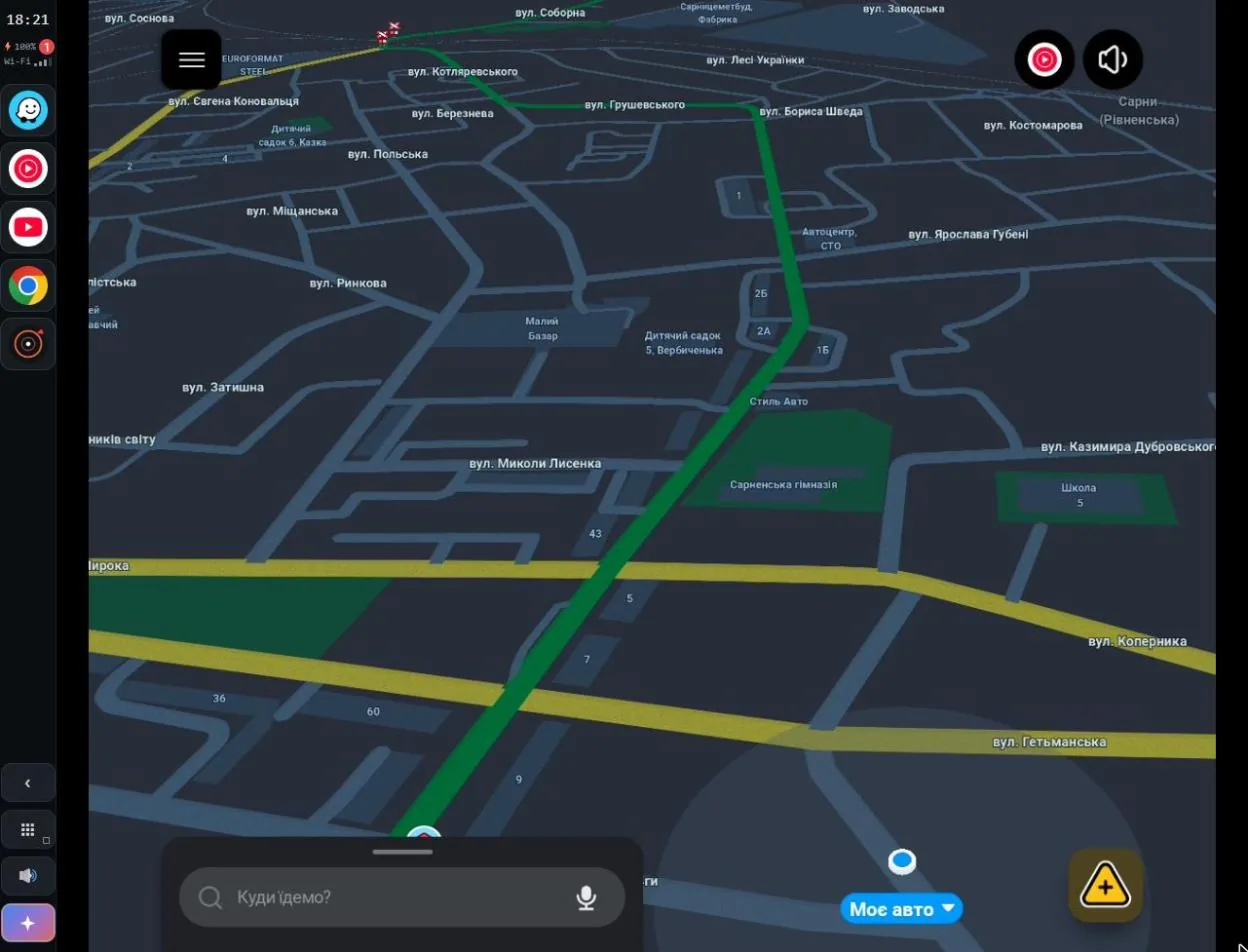 Waze with a route on the car screen, the ATTD control strip on the left